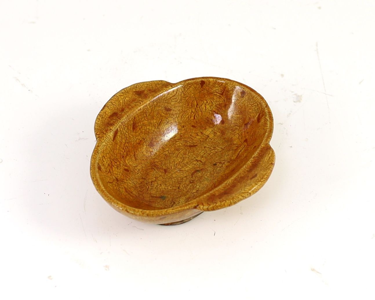 A Chinese amber glazed marbled pottery ear cup, possibly Tang/Liao dynasty, 10.5cm